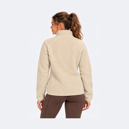 A woman shown from the back wearing a beige Sherpa Fleece Jacket – Women&