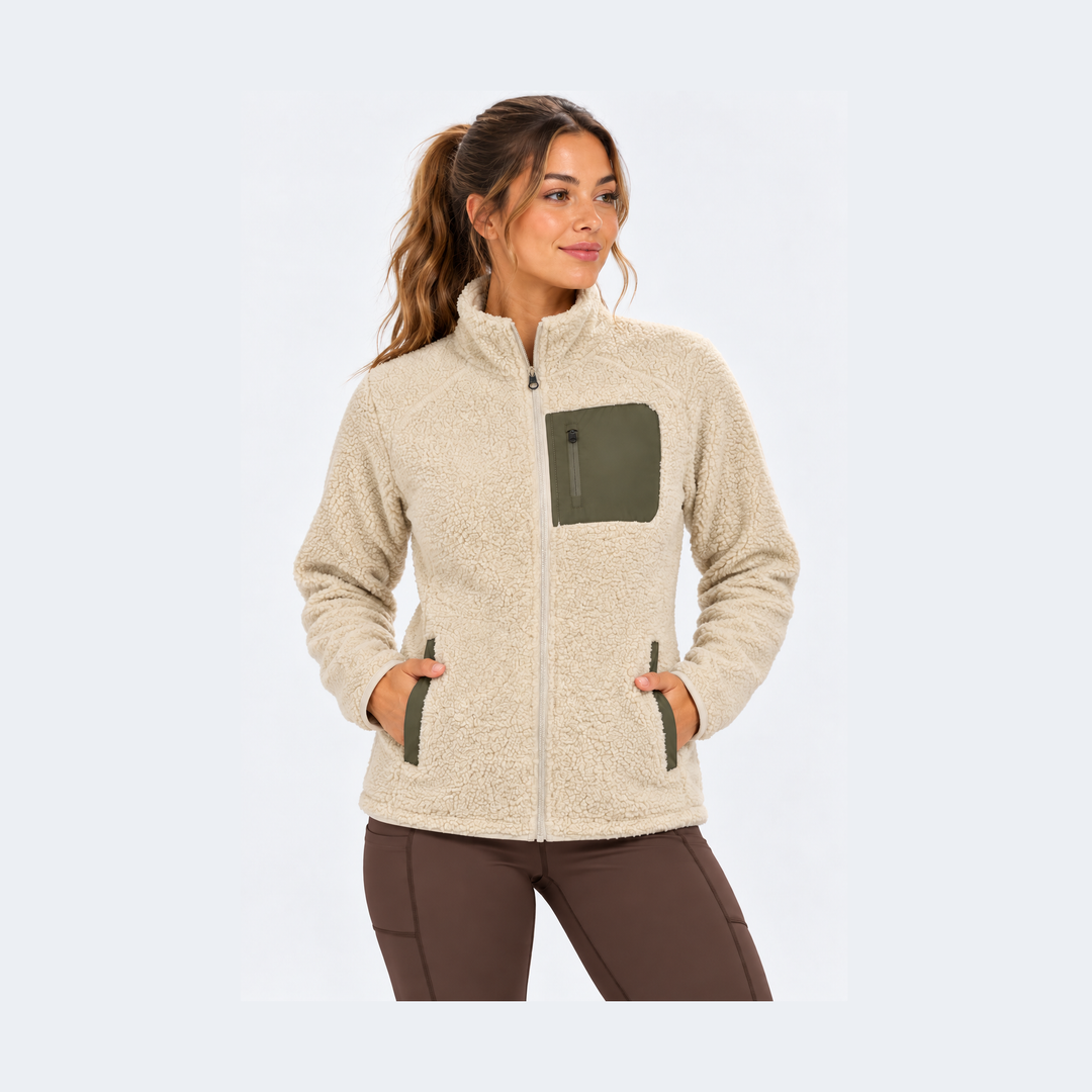 A woman wearing a beige sSherpa Fleece Jacket – Women&