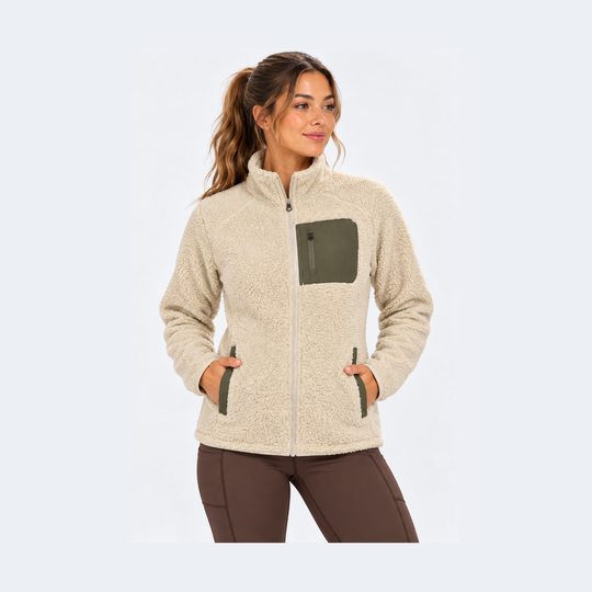 A woman wearing a beige sSherpa Fleece Jacket – Women&