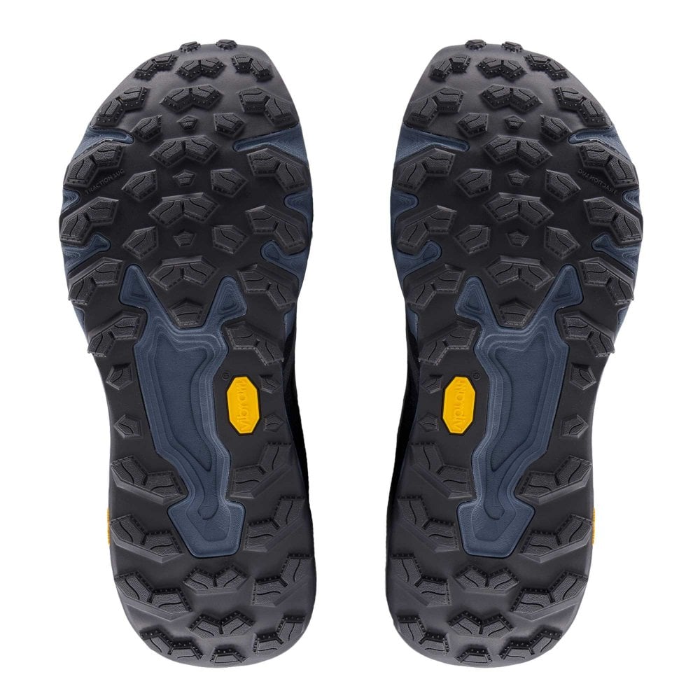 A pair of New Balance Fresh Foam X Hierro V9 shown from the sole view, featuring a dark gray and navy blue treaded outsole with yellow Vibram logos.