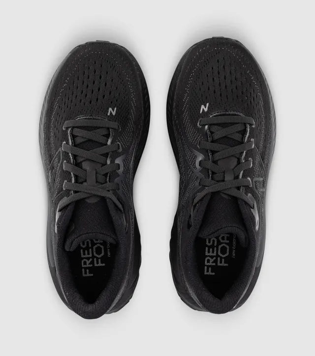A pair of blackNew Balance 860 V13 – Kids' running shoes shown from a top-down view on a light gray background.