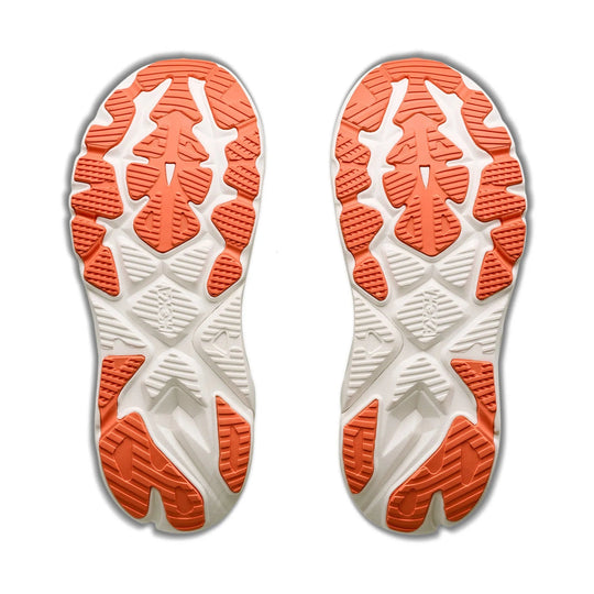 A pair of athletic shoe soles shown from the bottom, featuring a white and orange tread pattern on a plain white background.