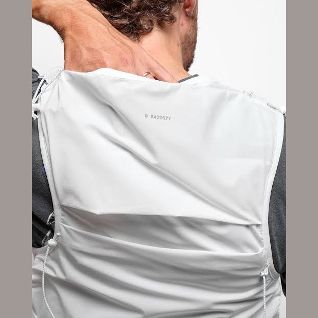 Close-up back view of a person wearing a light gray Justice Cordura 5L Hydration Vest over a dark gray shirt, with the brand name SATISFY printed subtly on the upper back.