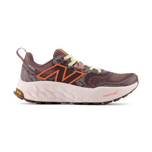 Brown New Balance Hierro V8 – Women's running shoe with orange accents on a white background