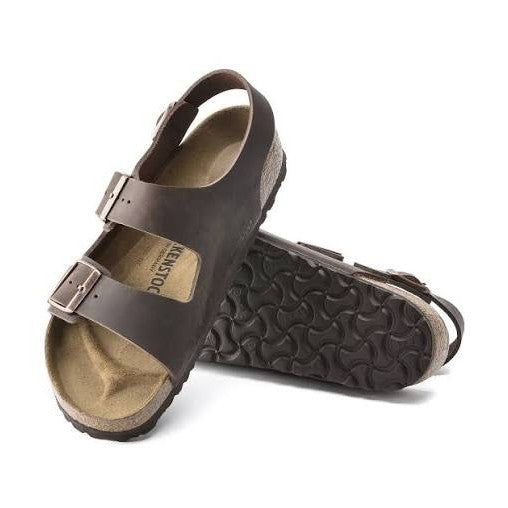 Brown leather Birkenstock Milano Soft Footbed sandals with a buckle on a white background