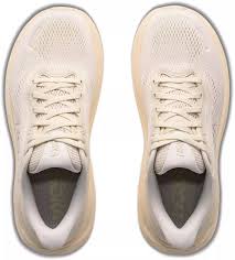 A pair of light beige Hoka Clifton 11 – Women's athletic sneakers shown from a top-down view on a plain white background.