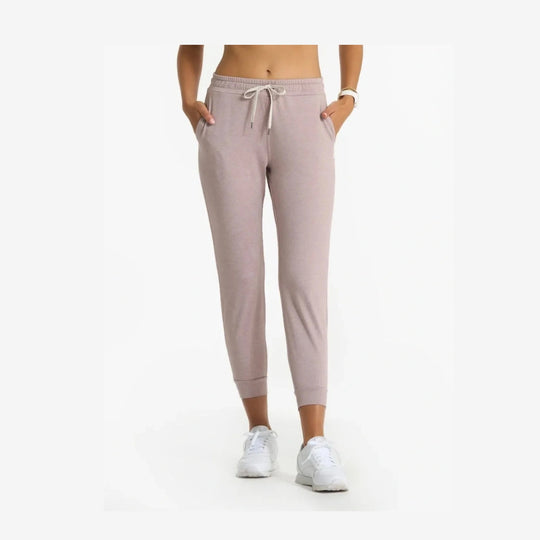A person wearing light dusty pink Vuori Performance Jogger – Women&