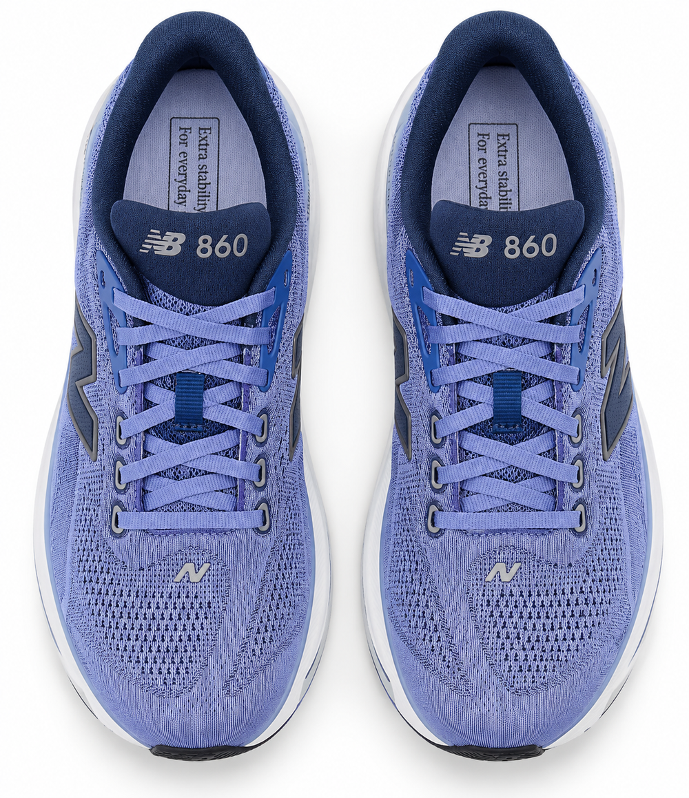A pair of New Balance Fresh Foam X 860 V15 – Men's running shoes shown from a top-down view. The shoes feature a light periwinkle blue and navy blue knit upper with matching blue laces, a dark navy heel counter, and a white midsole.