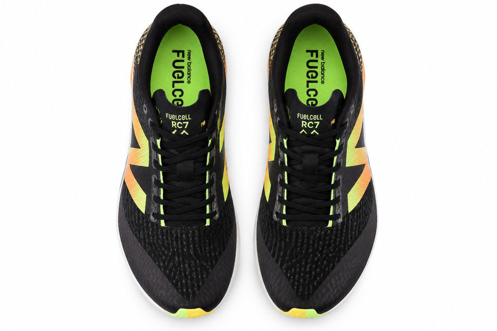 A pair of black New Balance Xc7 V5 – Men's running shoes with bright neon yellow and orange accents, shown from a top-down view on a white background.