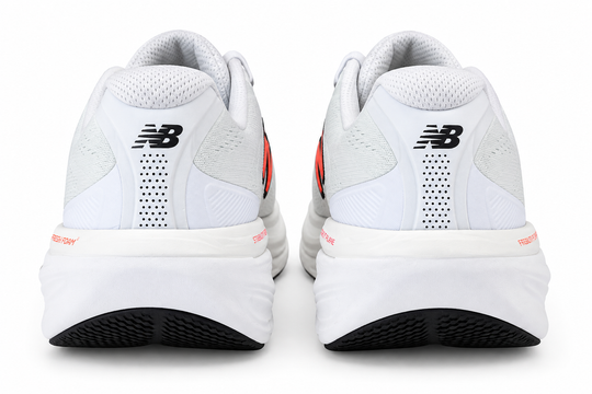 A pair of New Balance Fresh Foam X 860 V15 running shoes shown from the rear, featuring a white mesh and synthetic upper with black &