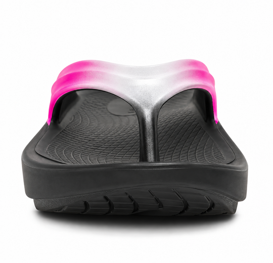 A single black Oofos OOLALA sandal with a bright pink and silver gradient strap, shown from a front-facing perspective on a white background.
