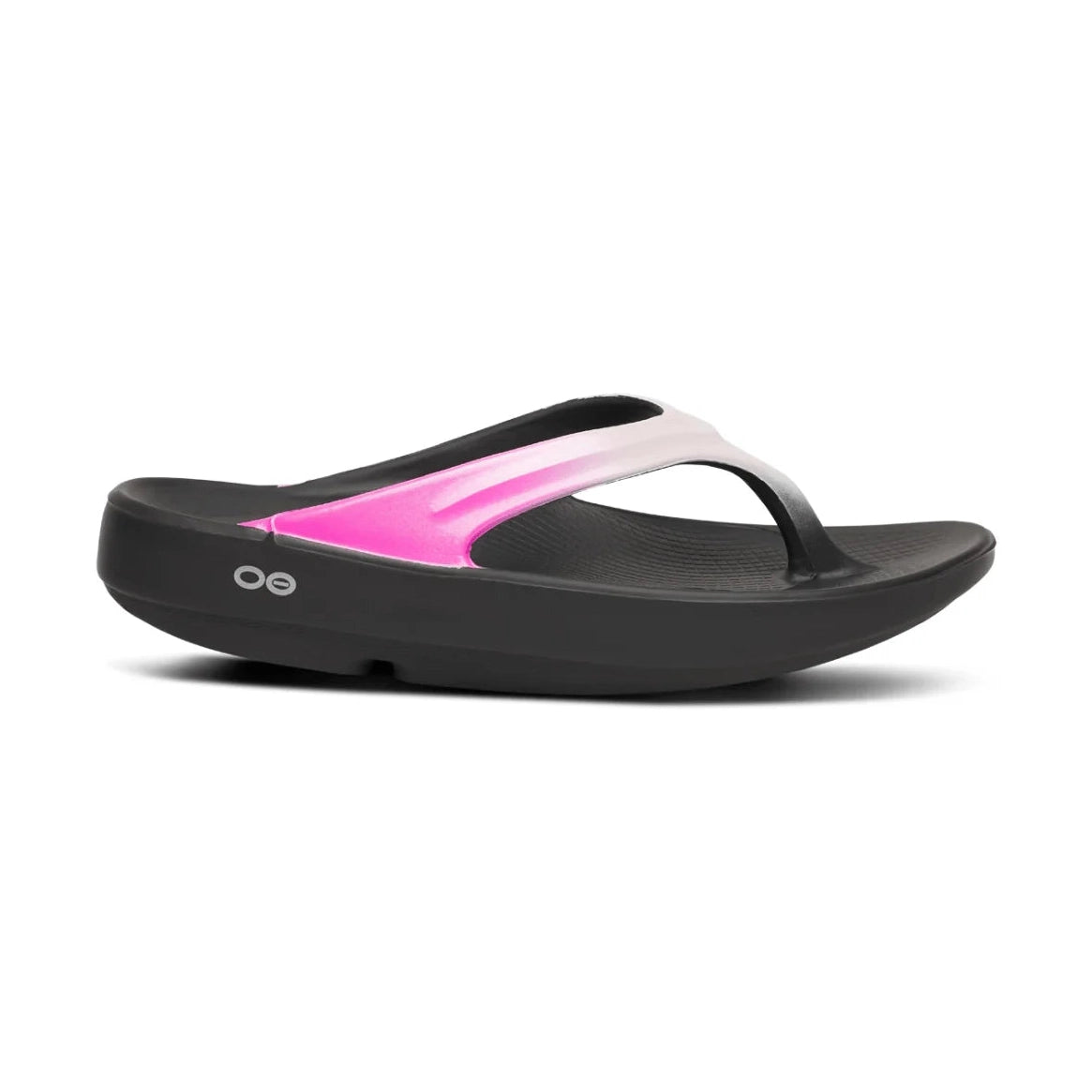 A single Oofos OOLALA black flip-flop sandal with a vibrant pink and white gradient strap, shown in a side profile on a white background.