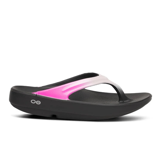A single Oofos OOLALA black flip-flop sandal with a vibrant pink and white gradient strap, shown in a side profile on a white background.