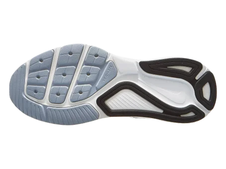 The outsole of a running shoe shown from a top-down view, featuring a white and light gray textured tread pattern with black protective accents.