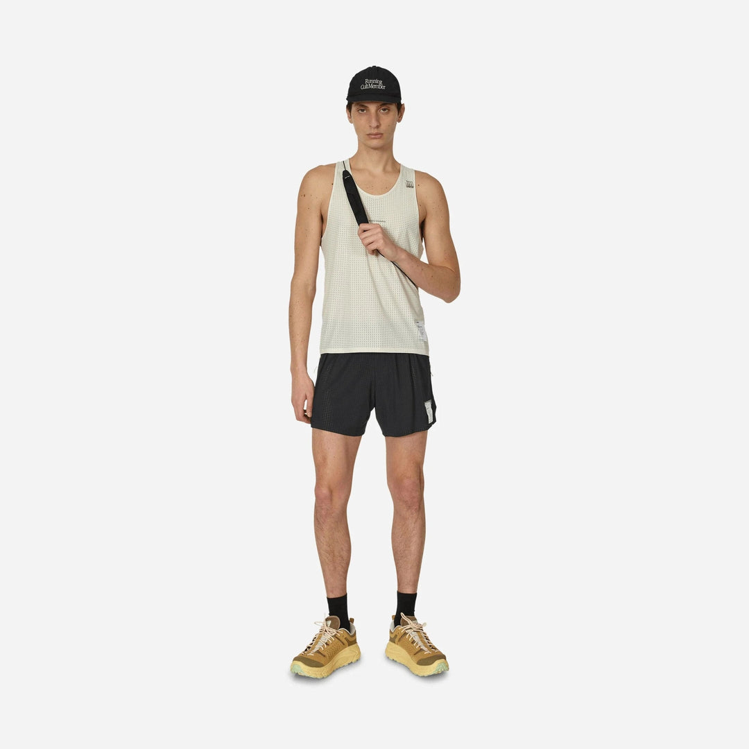A male model stands against a light gray studio background wearing a Space-O Singlet--Men&
