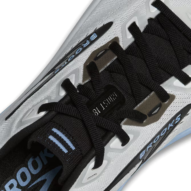 Close-up of a Brooks Ghost 18 running shoe with black laces and 'Brooks' branding on a white background
