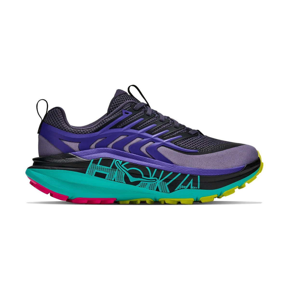 A Stinson 8 – Women's trail running shoe shown in a side profile view against a solid white background. The shoe features a dark gray mesh upper with purple overlays, a thick teal midsole with black graphic patterns, and bright neon accents on the outsole including pink, yellow, and black.