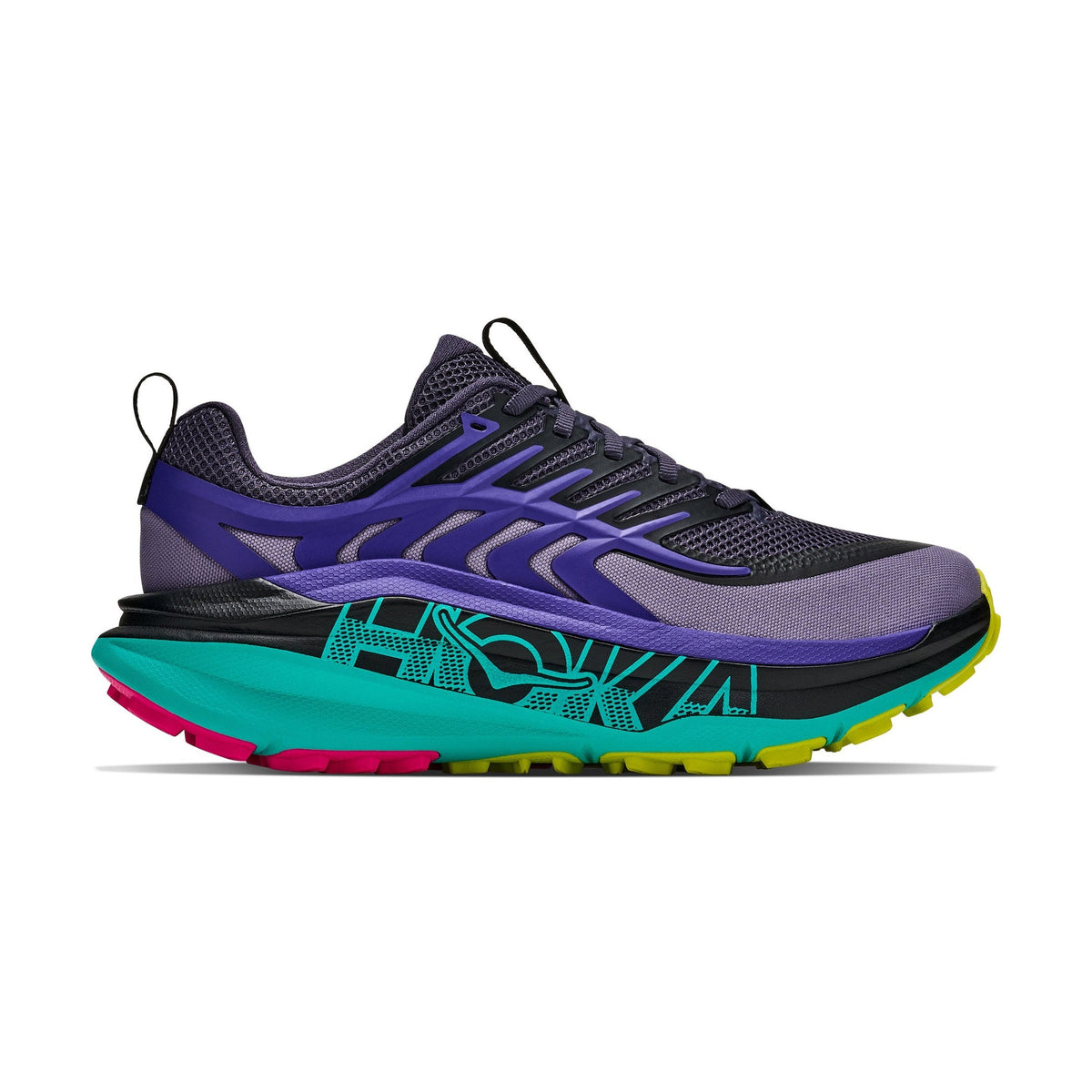 A Stinson 8 – Women's trail running shoe shown in a side profile view against a solid white background. The shoe features a dark gray mesh upper with purple overlays, a thick teal midsole with black graphic patterns, and bright neon accents on the outsole including pink, yellow, and black.