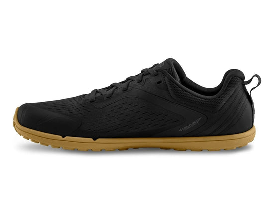 Black athletic shoe with brown sole on a white background