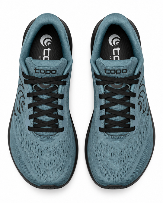 A pair of teal blue and black Topo Athletic Phantom 4 – Men&