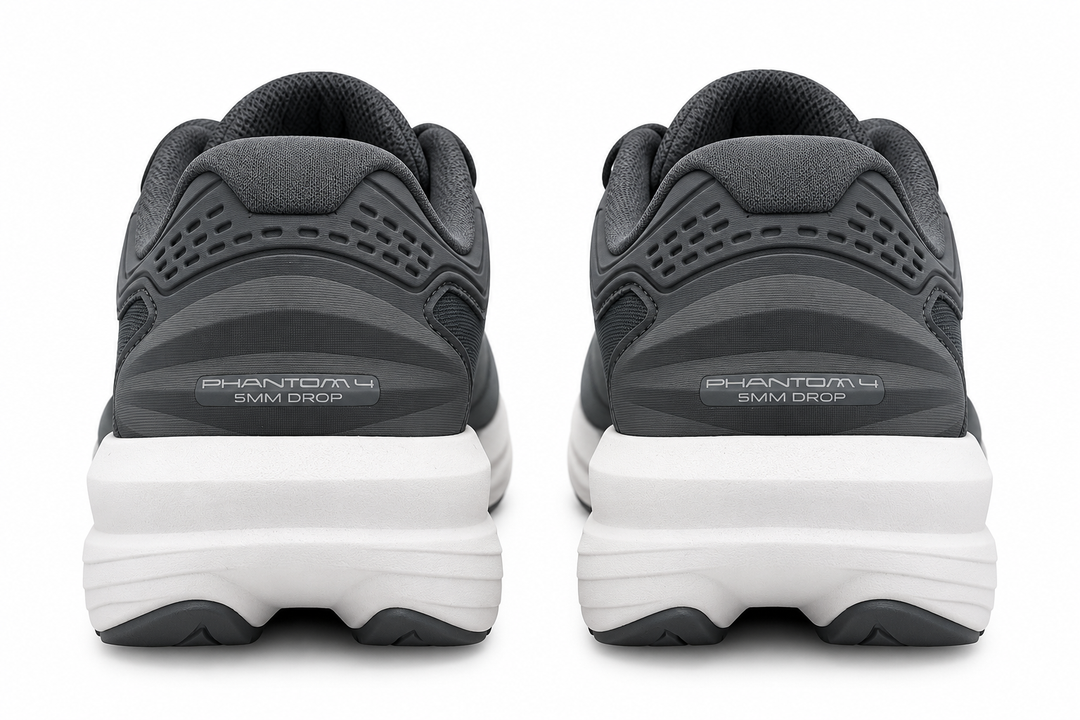 A pair of dark gray and black Topo Athletic Phantom 4 – Women&