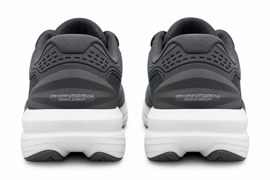 A pair of dark gray and black Topo Athletic Phantom 4 – Women&
