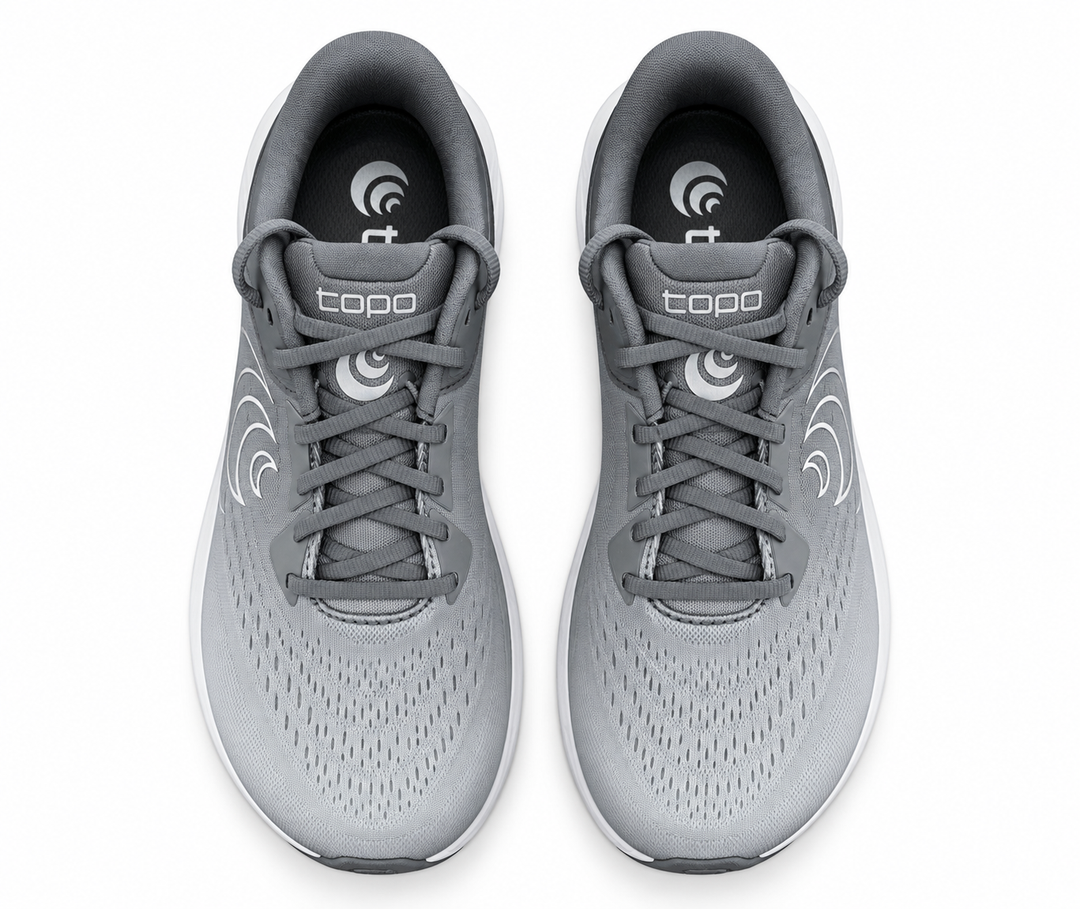 A pair of gray and white Topo Athletic Phantom 4 – Women&