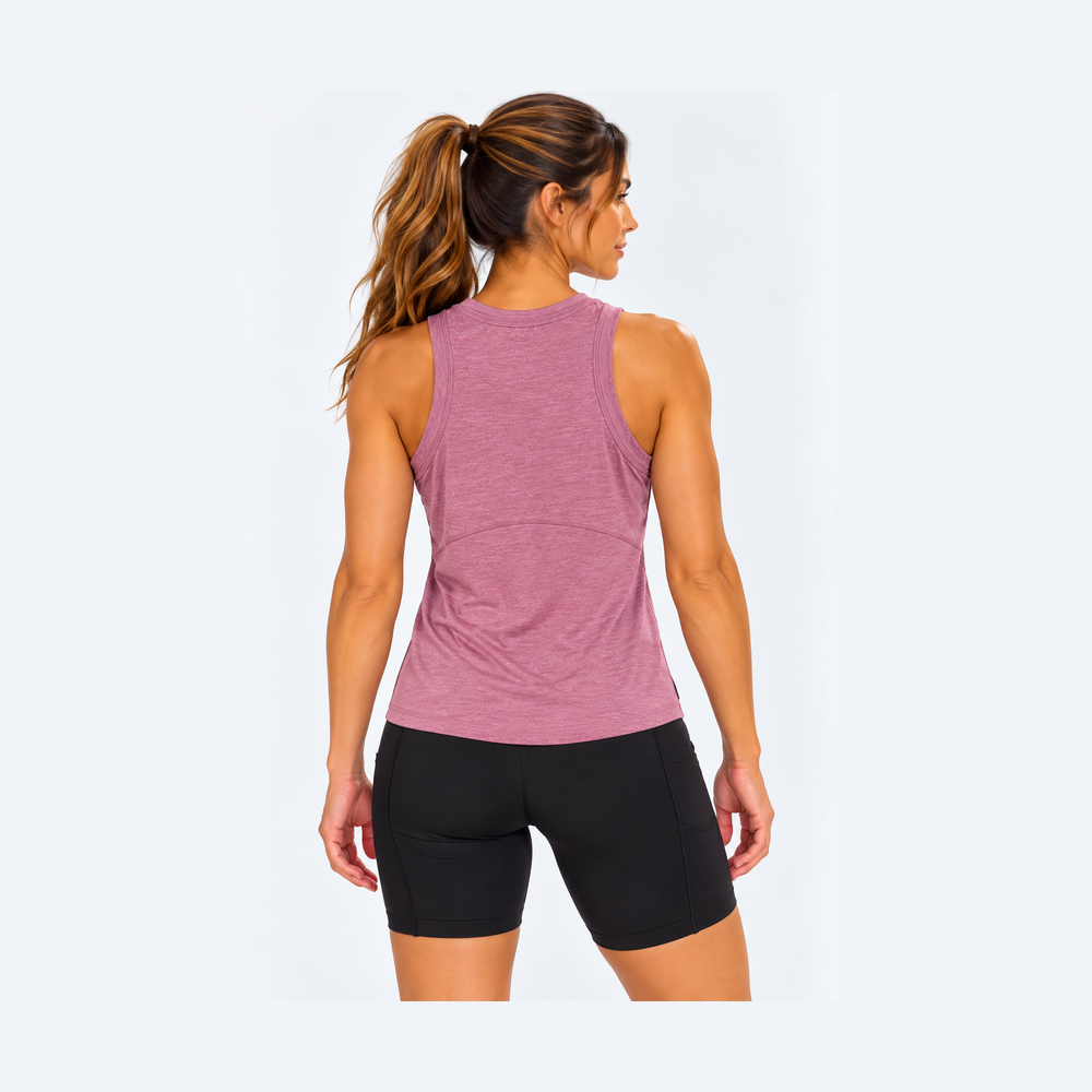 Rear view of a woman wearing a High Neck Tank Top – Women's in dusty mauve and black bike shorts against a light gray studio background.
