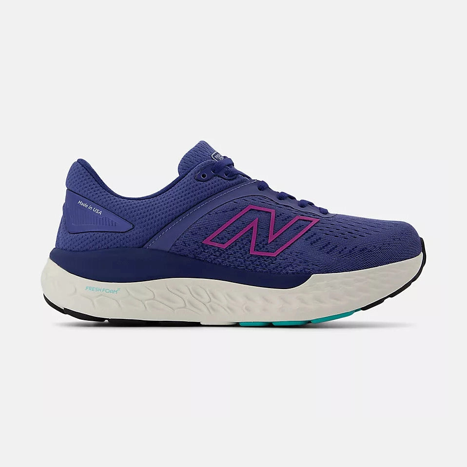 Blue New Balance Fresh Foam X 1540 – Women's running shoe with pink logo on a white background
