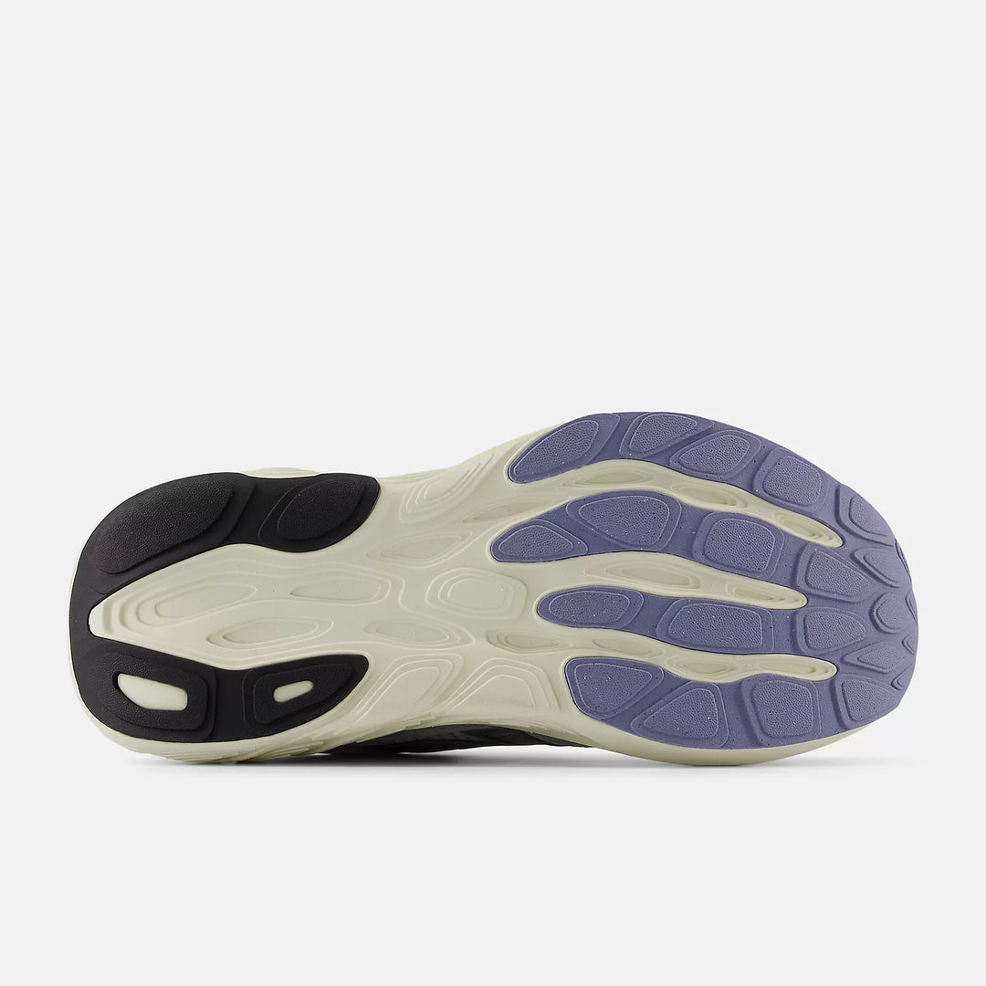 Close-up of a shoe sole with purple and black design on a white background