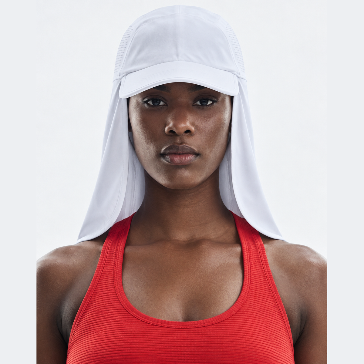 A close-up of a model wearing a white On Running Solar Cap with a mesh brim and a large neck flap, paired with a red ribbed tank top against a light gray background.