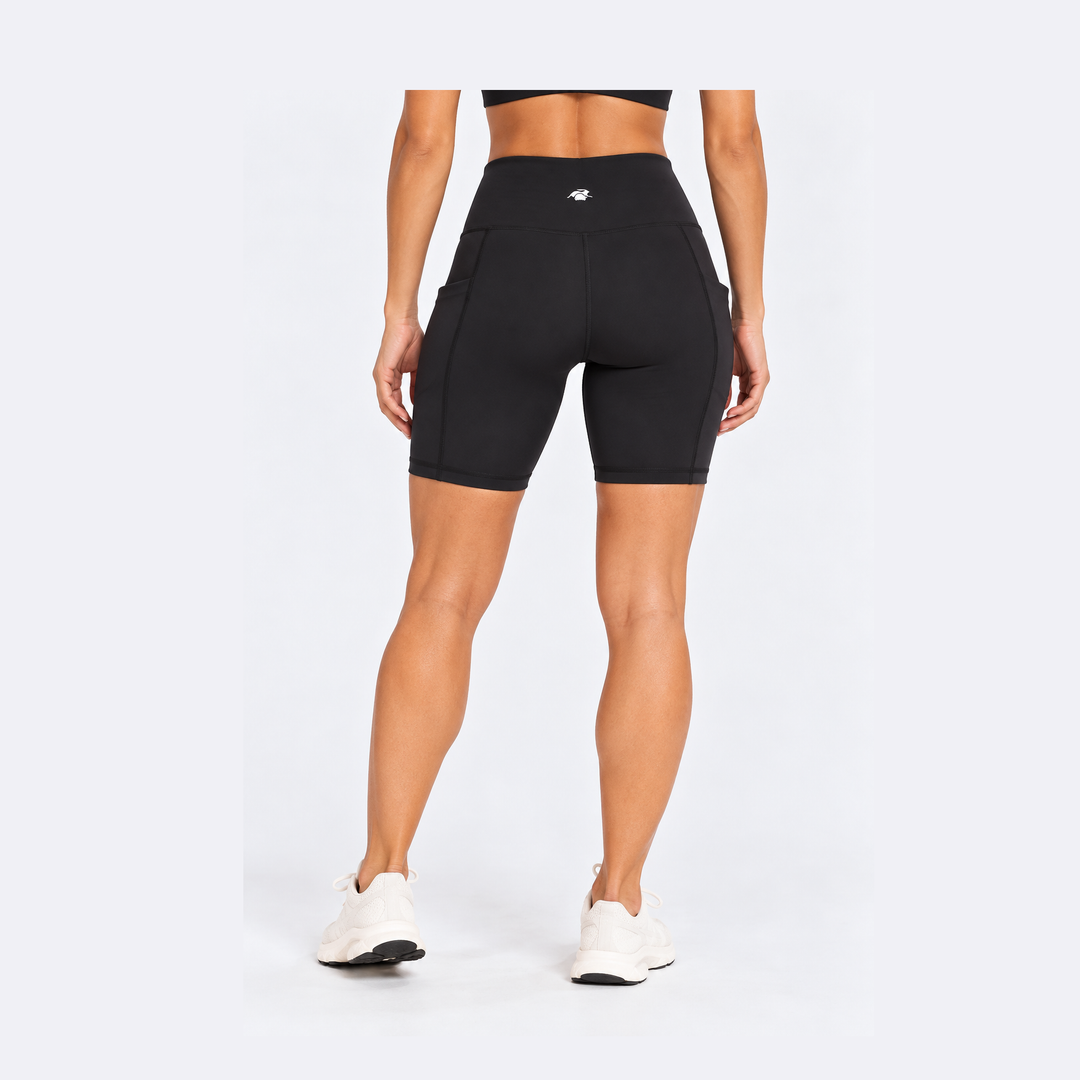 Rear view of a model wearing black high-waisted 7" Running Bike Short – Women&