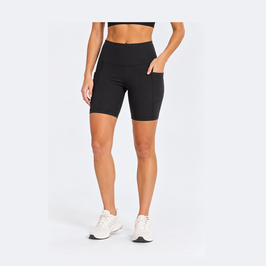 A model wearing black high-waisted 7" Running Bike Short – Women&