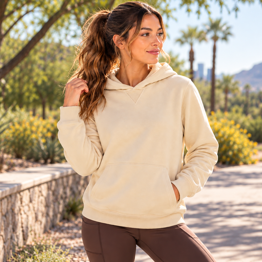 A woman wearing a cream-colored French Terry Hoodie – Women&