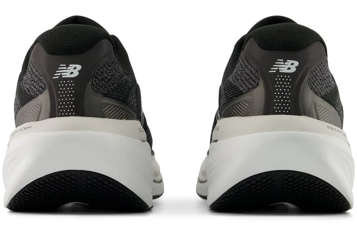 Black New Balance Fresh Foam X 860 V15 running shoes with white soles on a white background