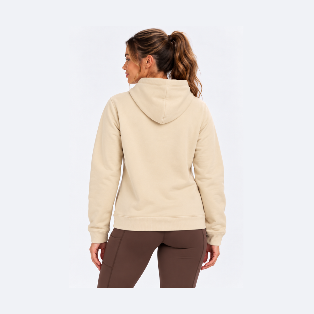 A woman shown from the back wearing a light beige French Terry Hoodie – Women's and brown leggings against a plain white studio background.
